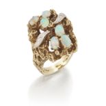 An opal and diamond ring, the openwork abstract head claw set with oval cabochon opals, and with ...