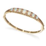 A 9ct gold opal and ruby bangle,