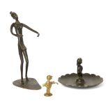 Hagenauer  Two figural sculptures comprising a golf caddy and dish surmount with infant, togethe...