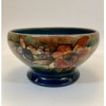 Moorcroft  Huge orchid pattern footed bowl, circa 1930s  Glazed earthenware  Underside impressed...