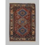 A Persian Yallemeh rug, last quarter 20th century, the central field with three geometric diamond...