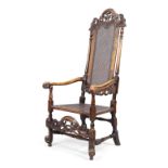 An English caned walnut armchair, in the William and Mary style, 19th century, the carved and pie...