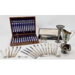 A group of silver plate, to include: a canteen of twelve fish knives and forks, with reeded handl...