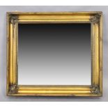 An English giltwood mirror, 20th century, the moulded frame set with bevelled plate, 86cm x 98cm