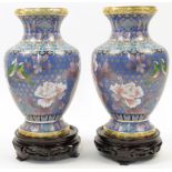 A pair of Chinese cloisonné enamel blue ground vases, 20th century, of tapered form rising from s...