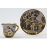 An Italian Majolica cup and saucer, 20th century, decorated in the style of Castelli, both unmark...