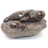 A Cornish Serpentine sculpture of a seal and a pup on a rock, late 20th / early 21st century, mon...