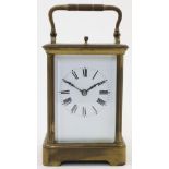 A French brass repeating carriage clock, late 19th / early 20th century, the corniche case with b...