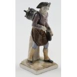 A Höchst porcelain figure of a merchant, 18th century, gold crowned wheel mark, 17.7cm high, bear...