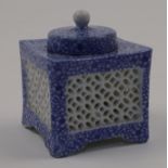 A Japanese porcelain inkwell, 20th century, with removable well, the exterior with pierced sides ...