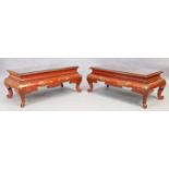 A pair of modern red chinoiserie low tables, 44cm high, 107cm wide, 57cm deep (2)