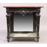 A French ebonised console table, 19th century, red marble top above frieze drawer, mirrored back ...