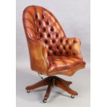 Ring Mekanikk, Norway, a Leather button back desk chair, Victorian style, on splayed mahogany leg...