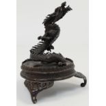 A Japanese bronze figure of a dragon, Meiji period, cast rising up into flight, loosely attached ...