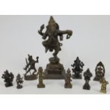 A bronze figure of a dancing Ganesha atop a leaf moulded base, 20th century, 17cm high, together ...