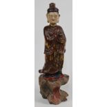 A Chinese gilt lacquer standing figure, early 20th century, standing on a stylised wood stand wit...