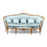 A Louis XV walnut canape corbeille, third quarter 18th century, the carved frame with floral blue...