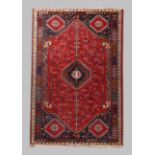 A Persian Qashgai rug, last quarter 20th century, central diamond medallion surrounded by geometr...