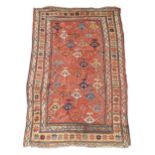 A Caucasian Kazak rug, first quarter 20th century, the central field with multi coloured geometri...