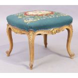 A French parcel gilt beechwood stool, Louis XV style, last quarter 19th century, floral needlewor...