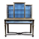 A French brass mounted and parcel gilt ebonised shop display cabinet, in the Louis XIV style, fir...