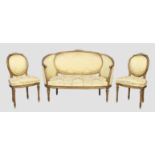 A French giltwood sofa and a pair of matching side chairs, Louis XVI style, first quarter 20th ce...