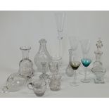 A collection of glassware, comprising: a large Astera commemorative champagne flute etched with a...