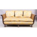 A French mahogany three piece bergere suite, first quarter 20th century, double caned, the frame ...