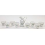 A group of eight porcelain tea bowls, c.1810-15, each with round funnel bowls and feet, decorated...