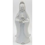 A Chinese Dehua porcelain figure of Guanyin, 19th century, modelled standing with long flowing ro...