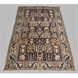 A Persian Bakhtiari rug, 20th century, the central tiled design field with geometric motifs, cont...