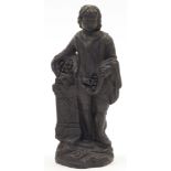 A black basalt figure of a youthful man, possibly Wedgwood, 19th century, modelled leaning agains...