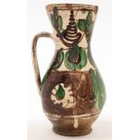 A Spanish Teruel style terracotta jug, 19th / 20th century, of simple baluster form with squat fo...