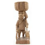 Follower of Lamidi Fakeye, Nigerian, 1928-2009, a carved hardwood sculpture of a farmer and his d...