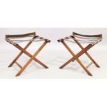 A pair of mahogany folding luggage racks with leather straps, 20th century, 50cm high, 56cm wide,...