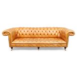 A Chesterfield three seat sofa, late 20th century, with tan leather button back upholstery, raise...