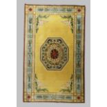 A large modern carpet, with central octagonal medallion on a cream ground with swan and laurel sp...
