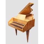 A Sperrhake Passau walnut cased harpsicord, second quarter 20th century, raised on square taperin...