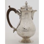 A silver hot water pot, London, 1934, Goldsmiths & Silversmiths Co Ltd, marks rubbed, of baluster...