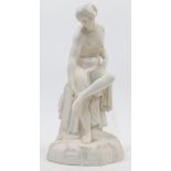 A Victorian Parian Ware figure of a Classical nude maiden, 19th century, modelled seated and pick...