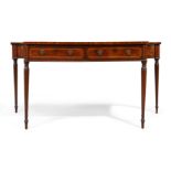 A George III boxwood inlaid mahogany serving table, first quarter 19th century, the top with conc...