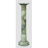 A green marble display column, 20th century, with octagonal stand above a Doric capital, the colu...