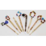 A collection of eight sewing bobbins, late 19th century, including seven bone examples with turne...