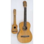 A Spanish acoustic guitar, with label for Hijos de Vicente Tatay S.R.C., Valencia, 94cm long; tog...