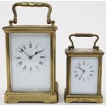 A French brass carriage clock, late 19th / early 20th century, the corniche case with bevelled gl...