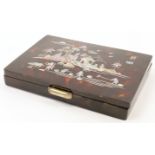 A Chinese tortoiseshell vanity box, 20th century, inlaid to the cover in abalone with a figural l...