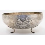 A circular footed bowl, stamped 800S, possibly Cypriot, with three repousse vignettes depicting a...