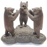 A German carved hardwood sculpture of three black forest bears, 20th century, each modelled stand...