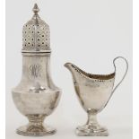 A George III silver milk jug, London, 1798, maker mark rubbed, of helmet form with punched rim an...