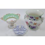 A Minton porcelain Chinoiserie set of six egg cups and stand, 19th century, decorated with scroll...